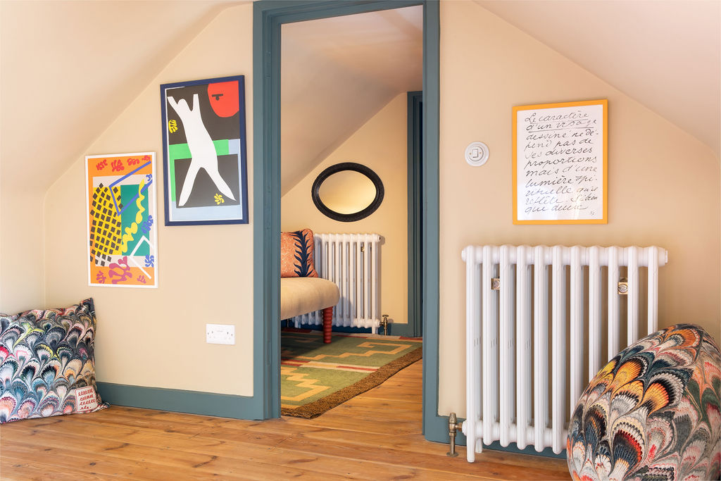 Beata Heuman Studios 188 Hammersmith Road with Castrads cast iron radiators under the kitchen bench seating